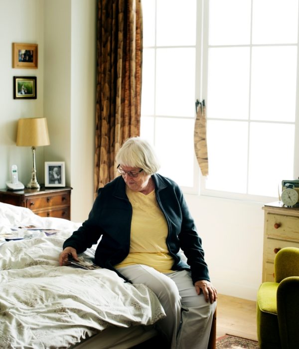 Senior woman sitting on the bed